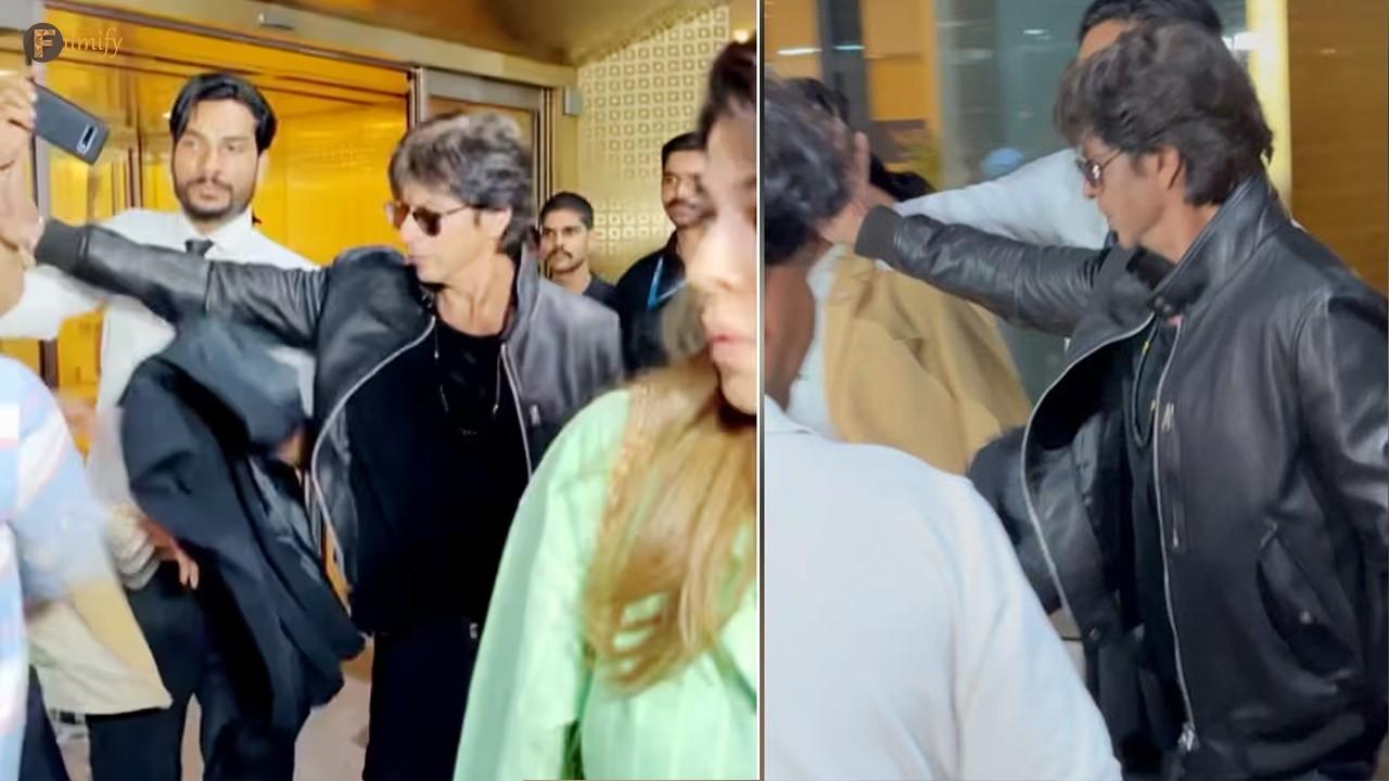 A fan tries and fails to take a selfie with SRK as he steps out of the Mumbai airport
