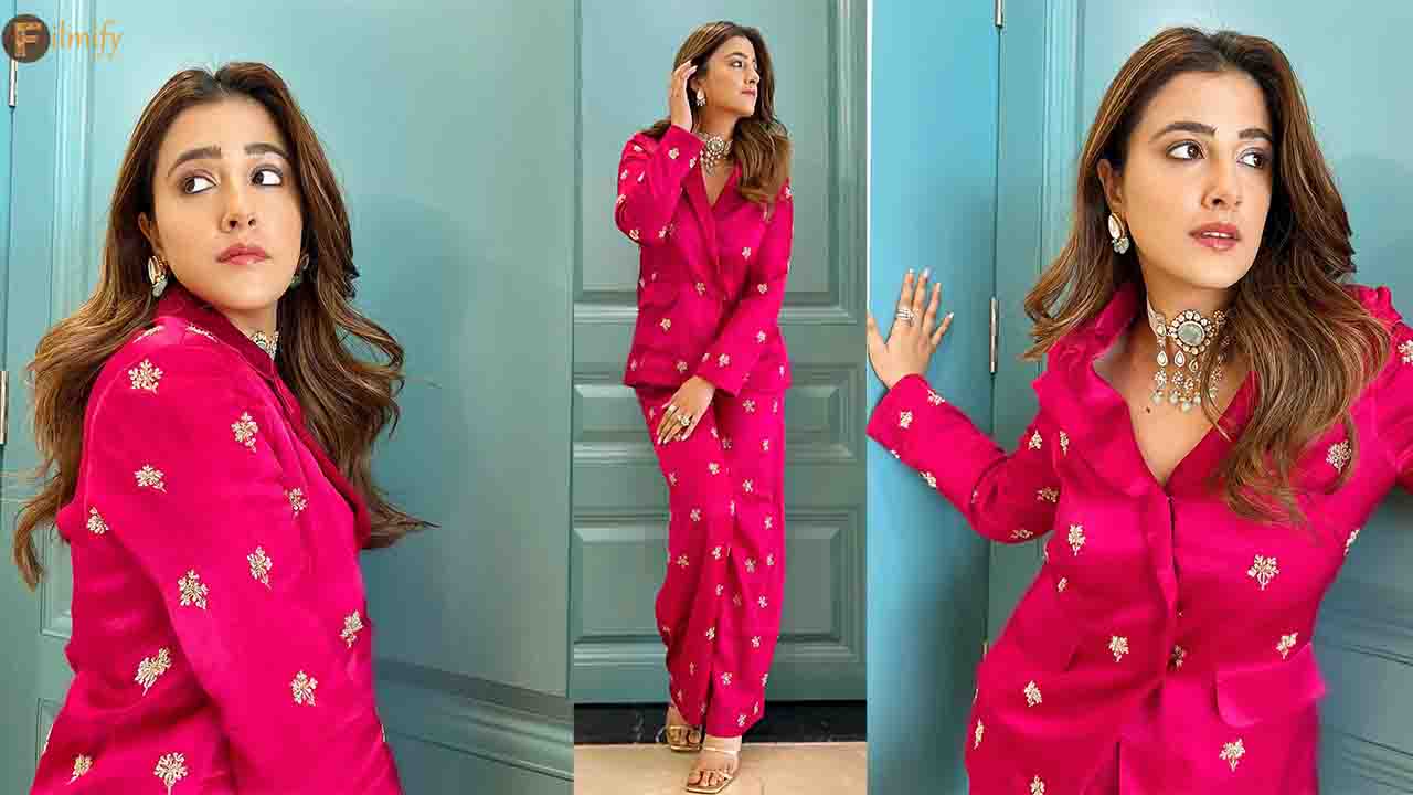 Nupur Sanon excudes style in a Bright Pink suit!
